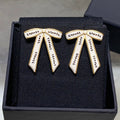 Chanel Black Letter Earrings with White Ribbon and Bow